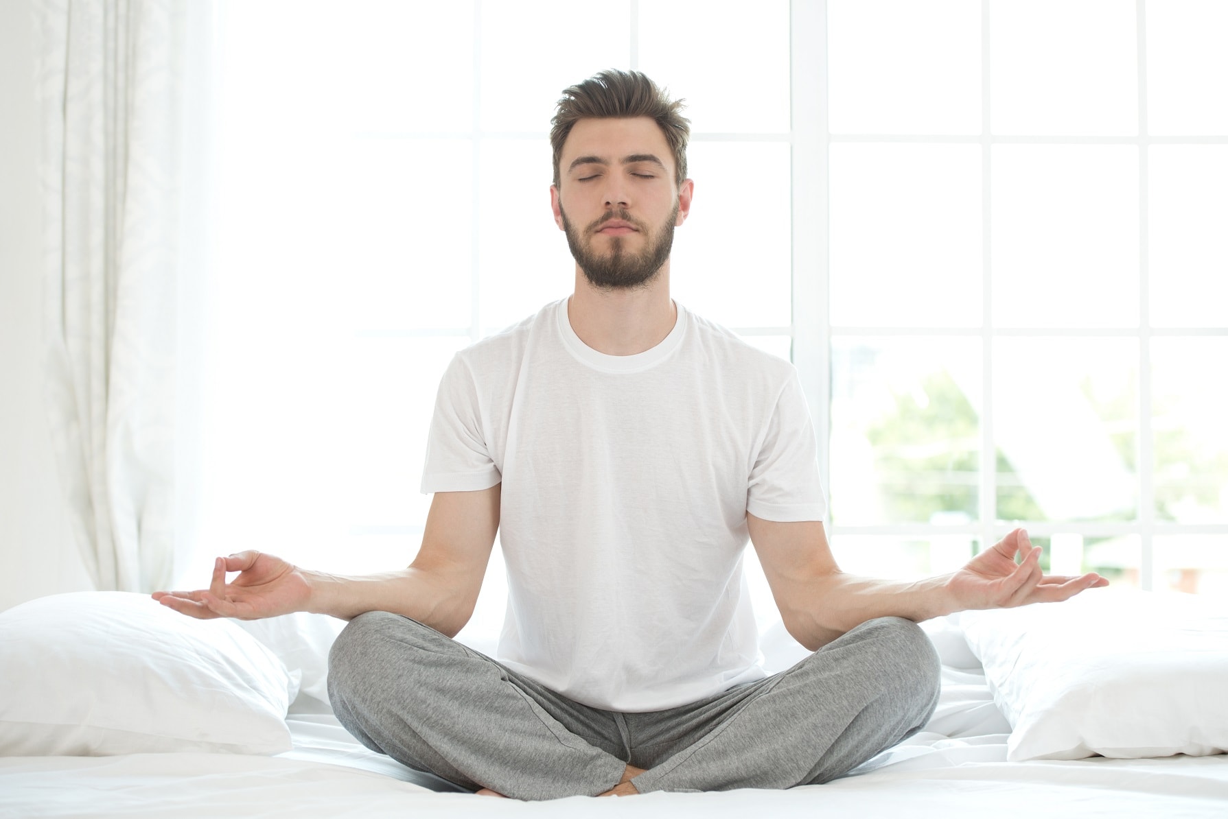 shutterstock_203072617-man-meditating-in-bed-4-28-2020-blog